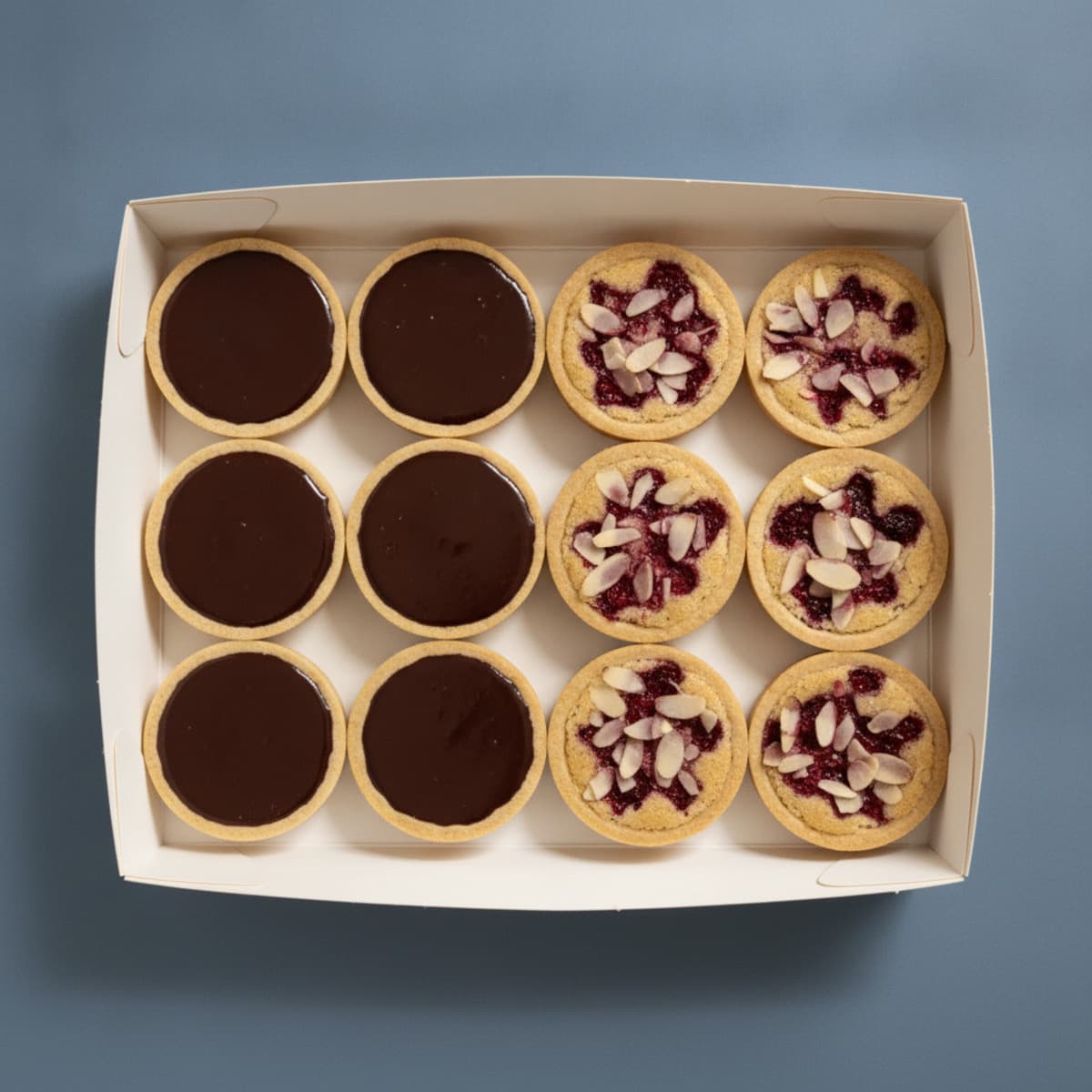 Chocolate Ganache + Almond Cream & Raspberry — Box of 12 photo