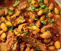 Fasoulia — Tender beans simmered with beef and rice in a rich, traditional Lebanese sauce